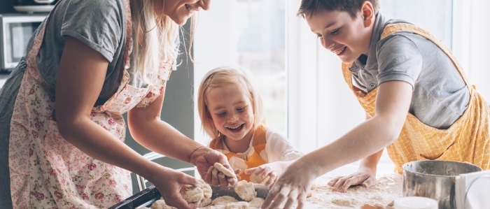 Mom cooking with kids in the kitchen