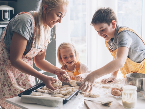 Mom cooking with kids in the kitchen